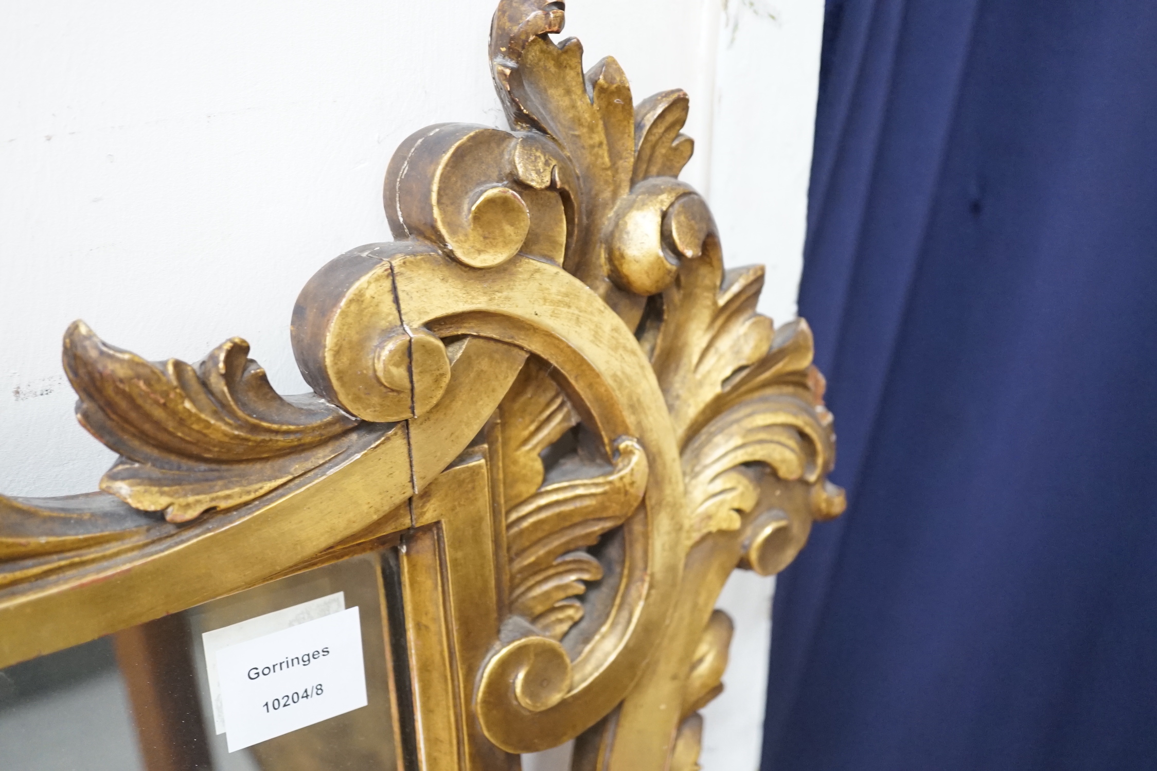 A rococo revival carved giltwood landscape mirror, width 160cm, height 113cm